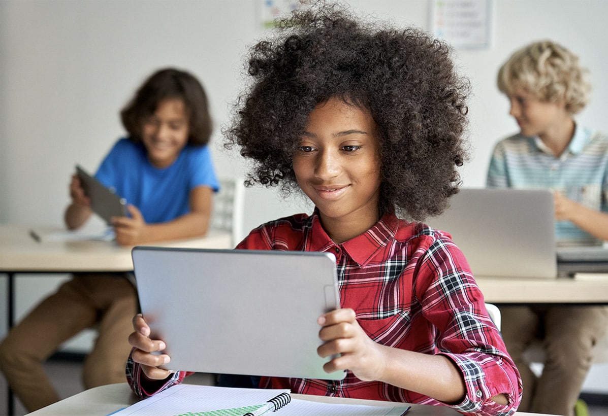 female student holding tablet